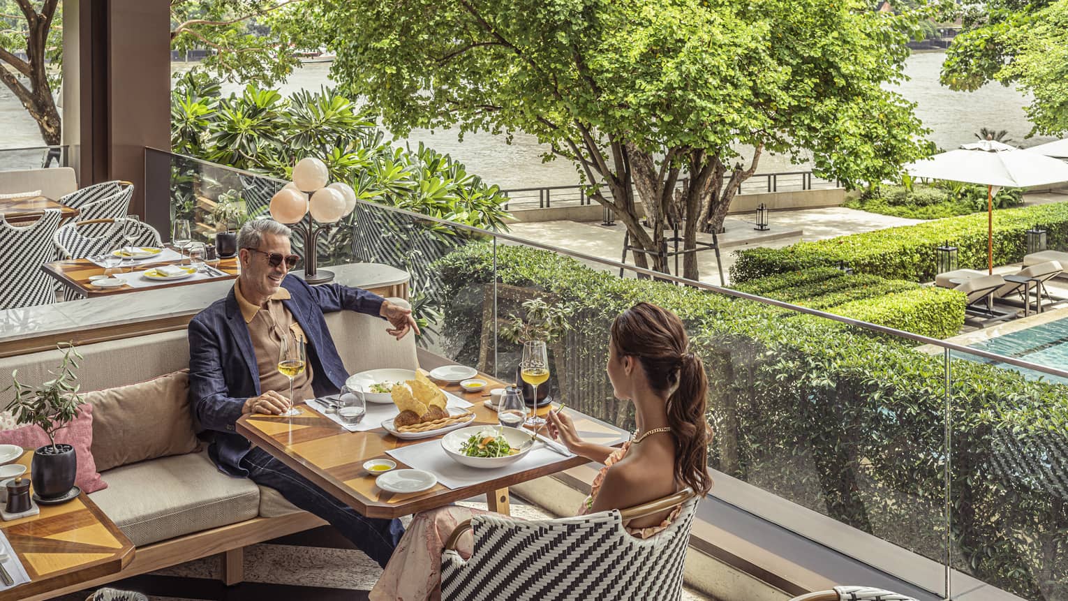 Couple enjoys a meal on the outdoor terrace at Riva