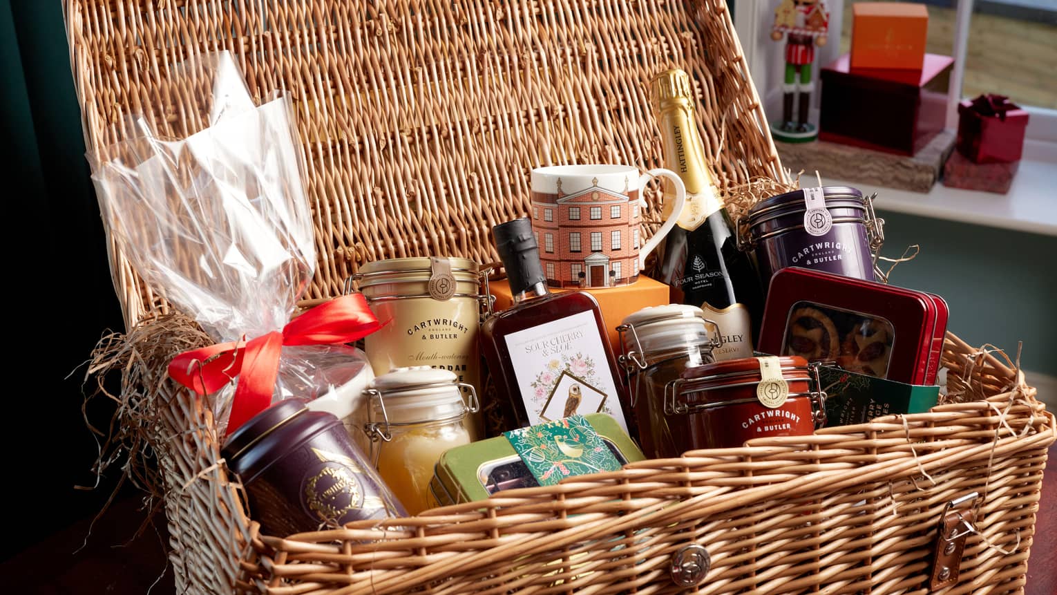 A basket with various festive good and ingredients.