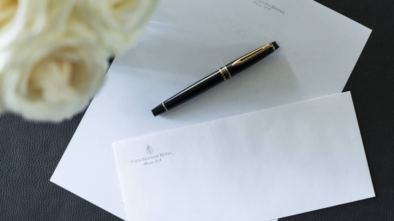 Paper and an envelope with Four Seasons letterhead.
