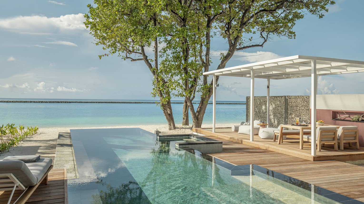 Private pool and lounge deck overlooking Maldivian ocean