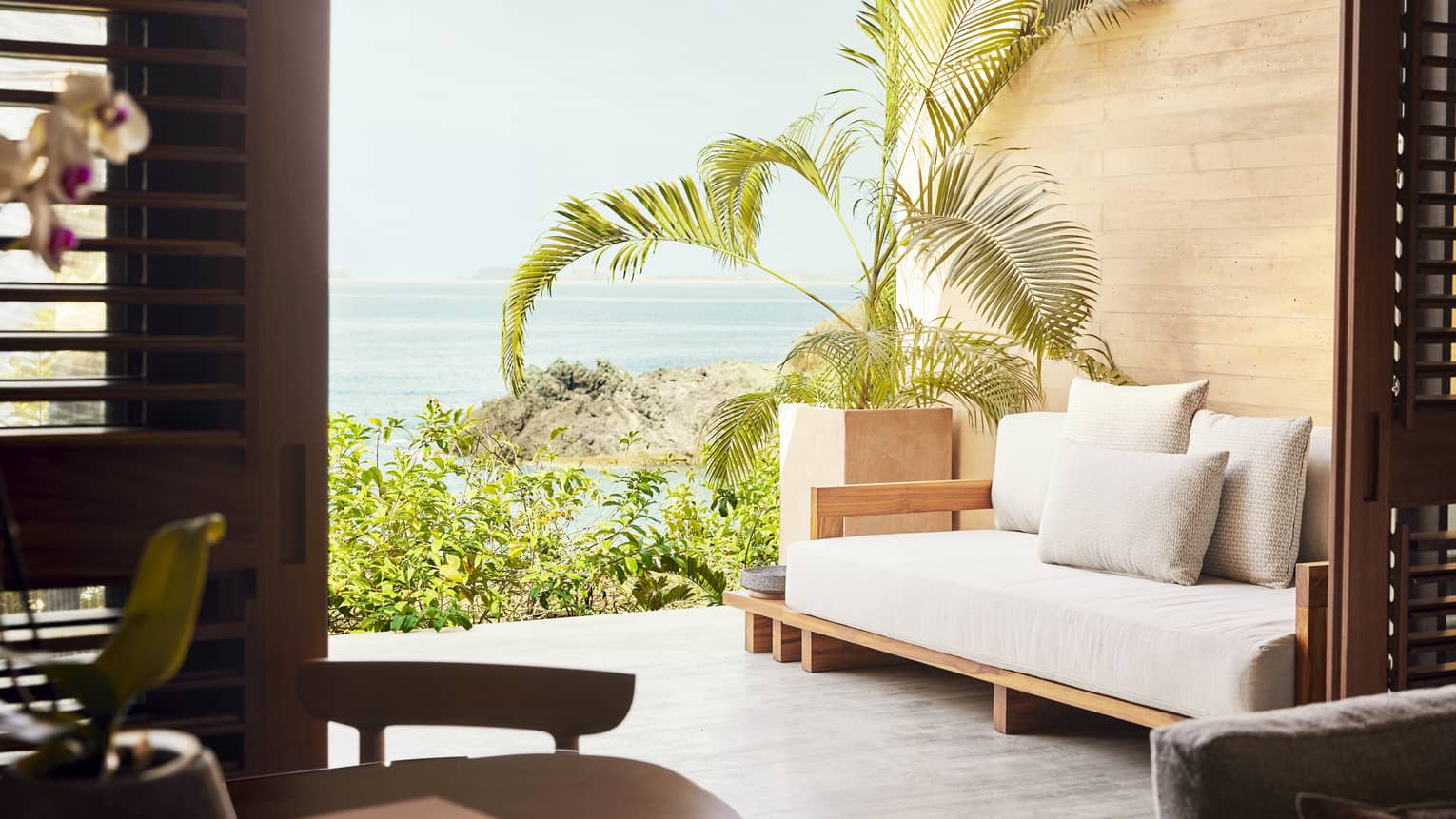 Hotel room terrace with modern sofa and Tamarindo beach view