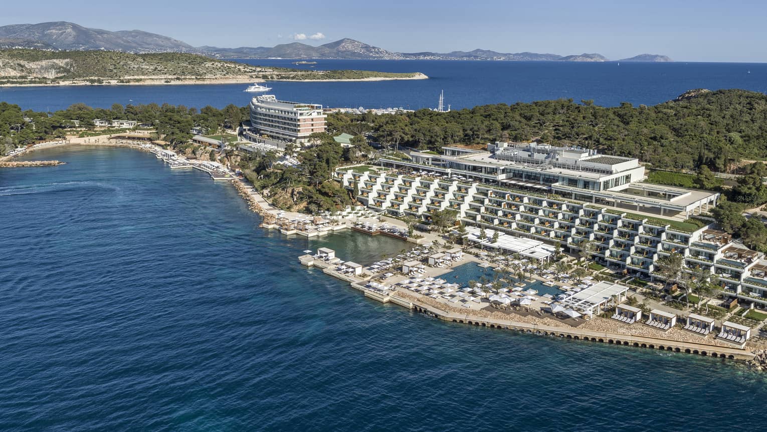 Sweeping aerial view of Four Seasons Astir Palace Hotel Athens along waterfront