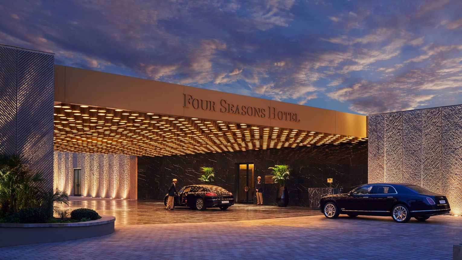 Modern Four Seasons Hotel Casablanca entrance at nights with lights, luxury cars
