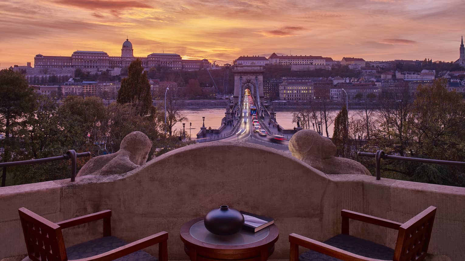 Royal Suite stone balcony with Danube River and Budapest view at sunset