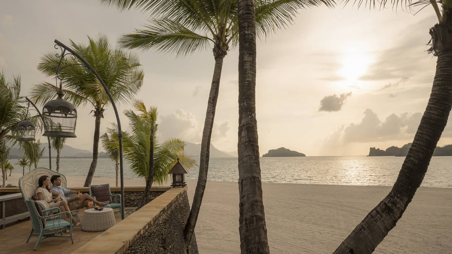 Upper Serai Sunset Lounge terrace overlooking the beach with view of palm trees