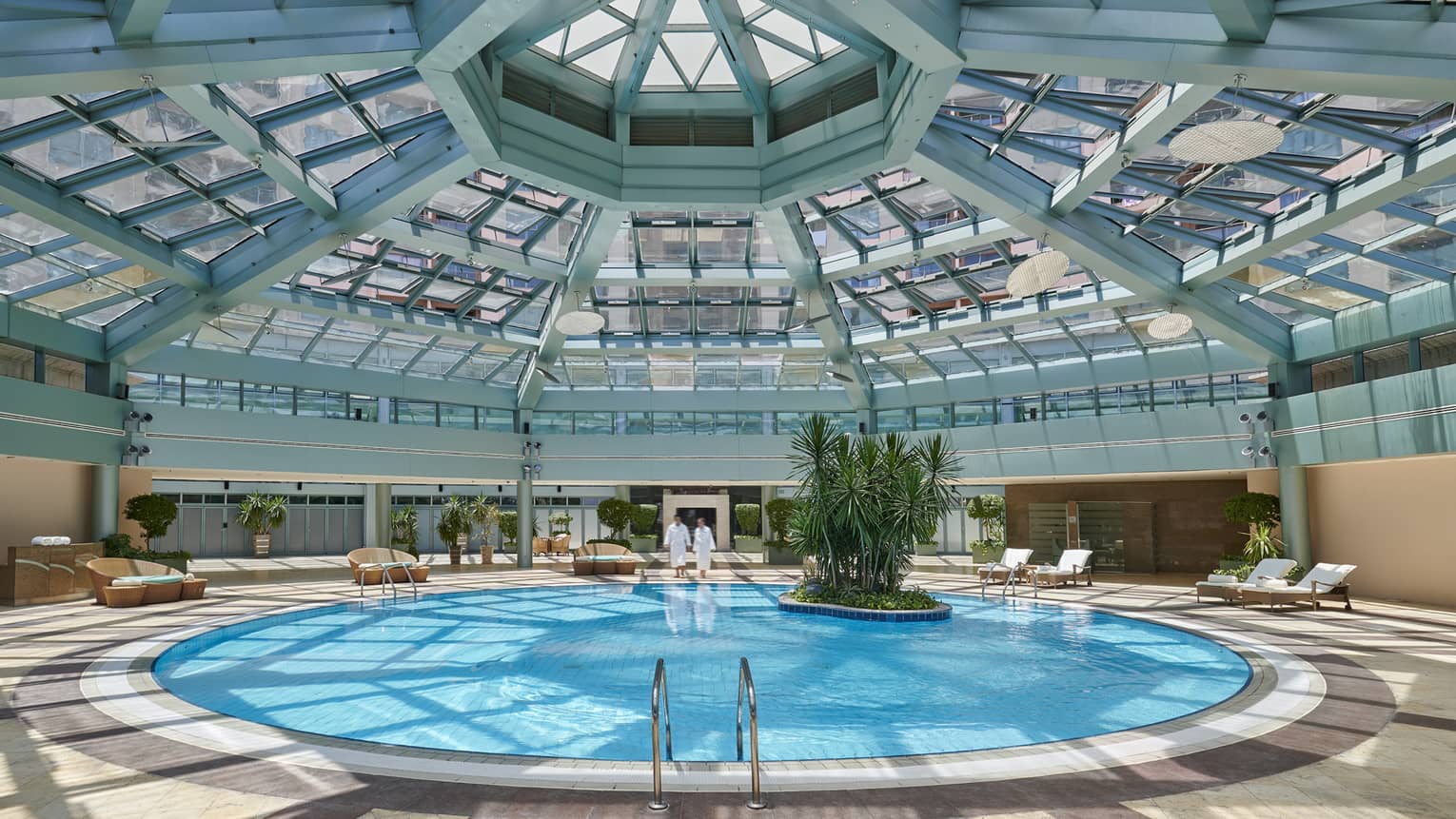 Skylights pour in natural light over the indoor pool at four seasons hotel alexandria 