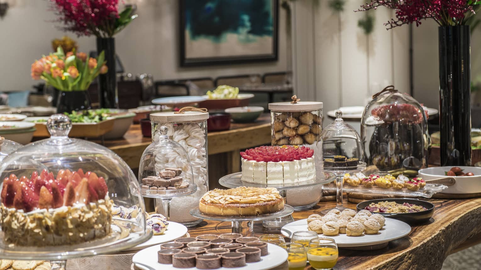 An arrangement of a variety of decadent desserts including cakes, tarts and soufflés 