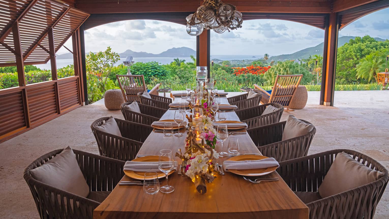 Table setting on terrace with mountain and sea views in the background