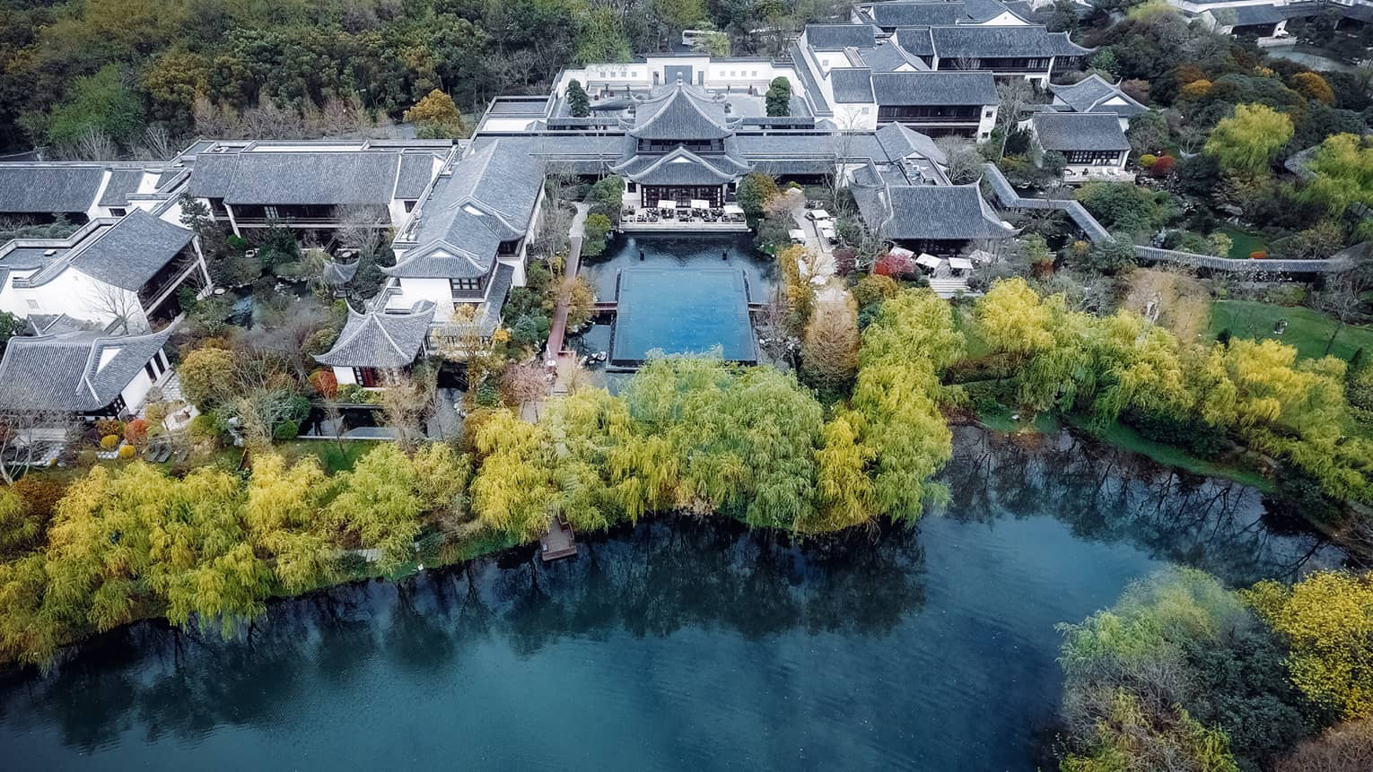 Aerial view of Four Seasons Hotel Hangzhou village-like resort on water