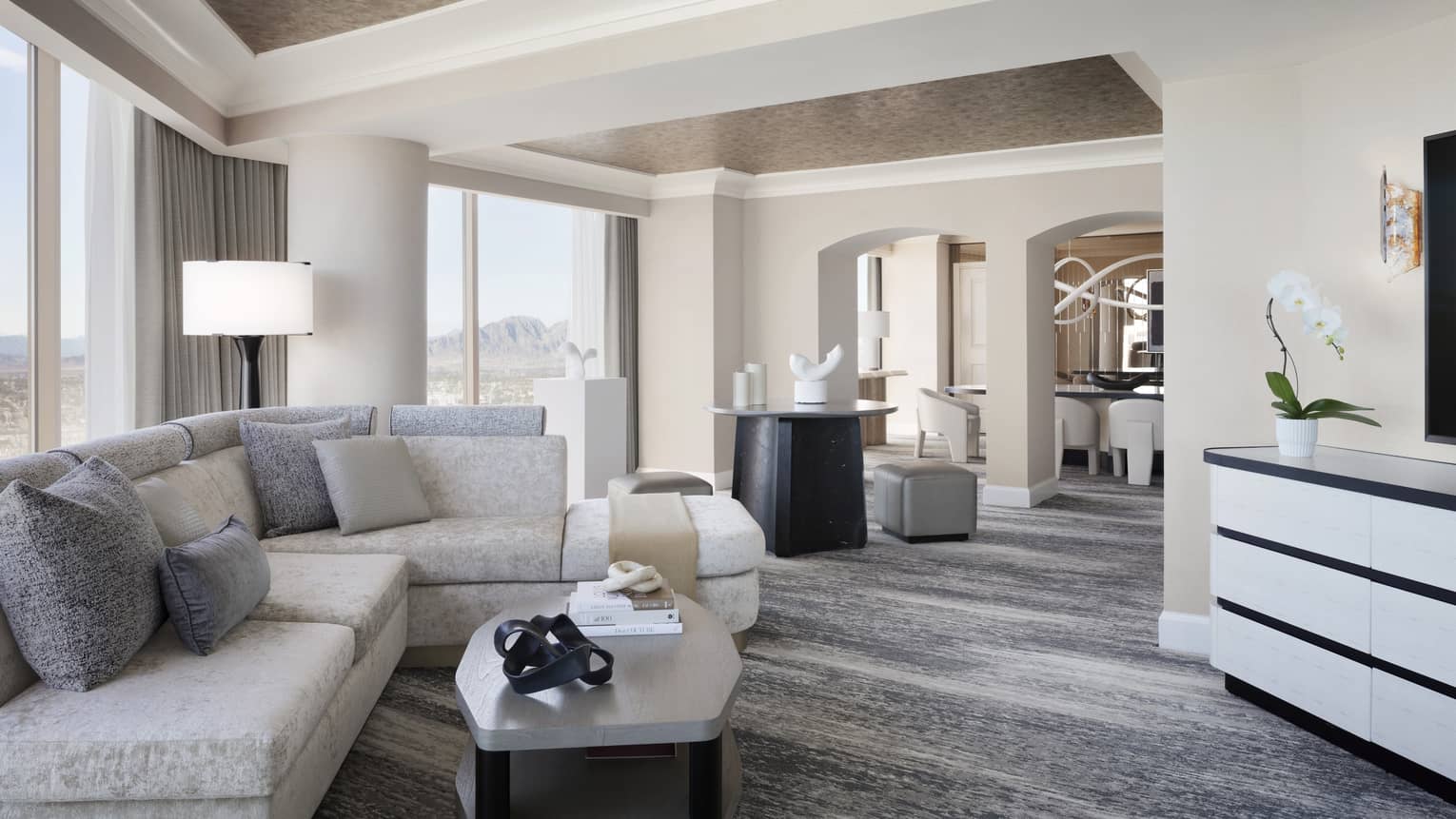 Large living room of Presidential Suite, designed with cream and grey tones, at Four Seasons Hotel Las Vegas