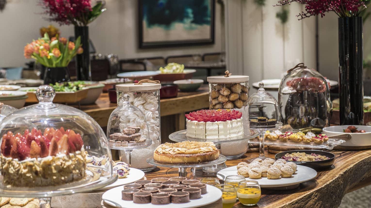 An arrangement of a variety of decadent desserts including cakes, tarts and soufflés 