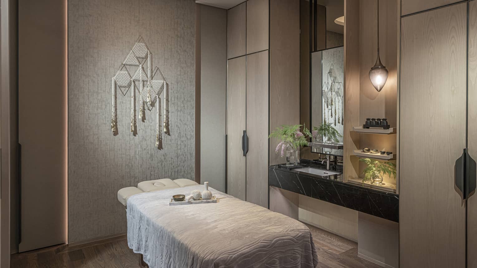 Private treatment room with single massage table