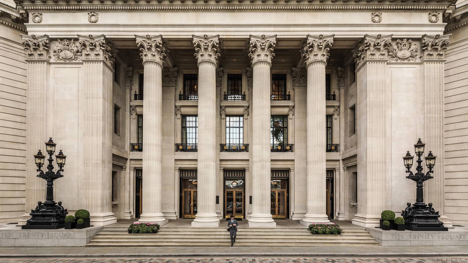 Ten Trinity Square front entrance with tall white stone pillars over steps