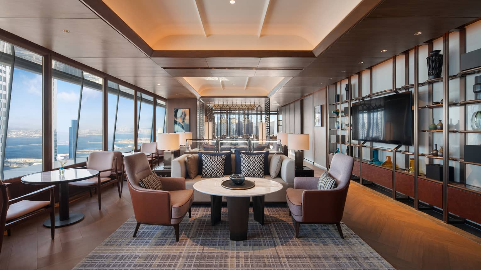 Sleek hotel executive lounge area with elevated city views of Dalian, China
