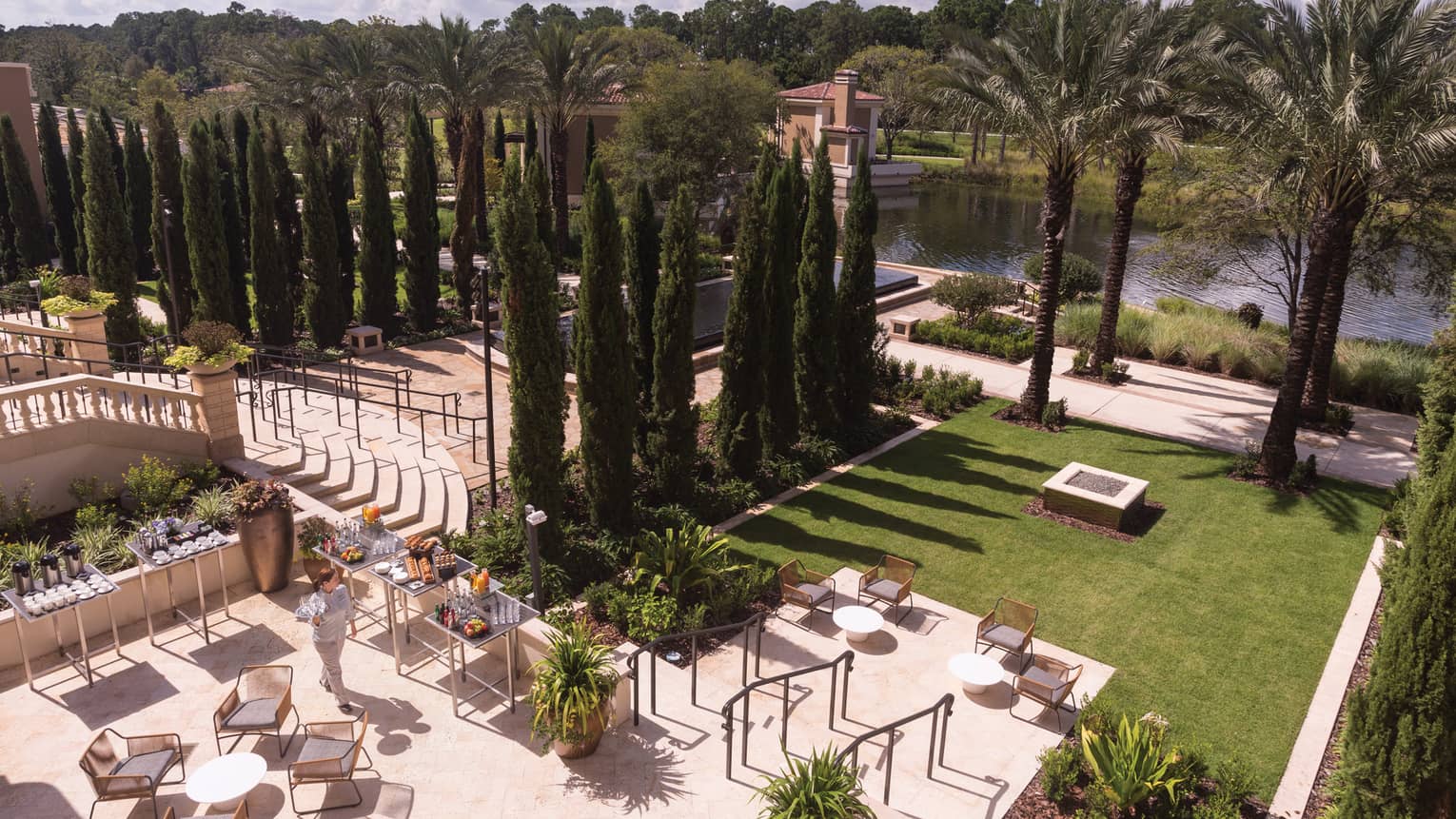 Aerial view of Sabal Terrace event space with dining patio, green lawn and rows of trees