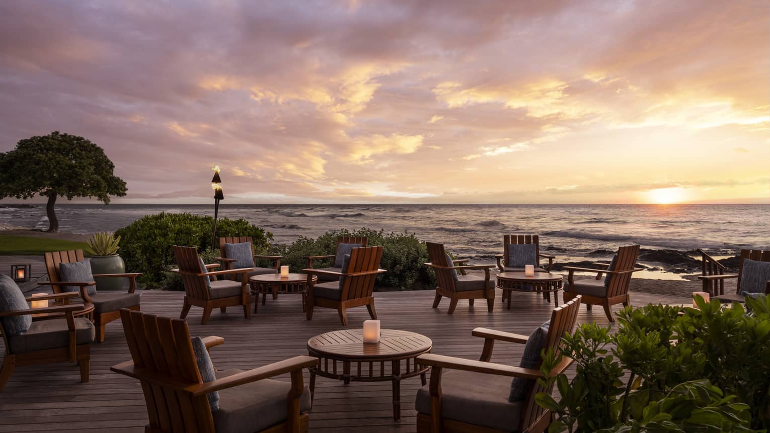 Restaurant terrace next to the ocean at sunset