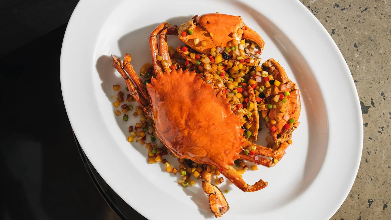 Whole crab on oval white plate