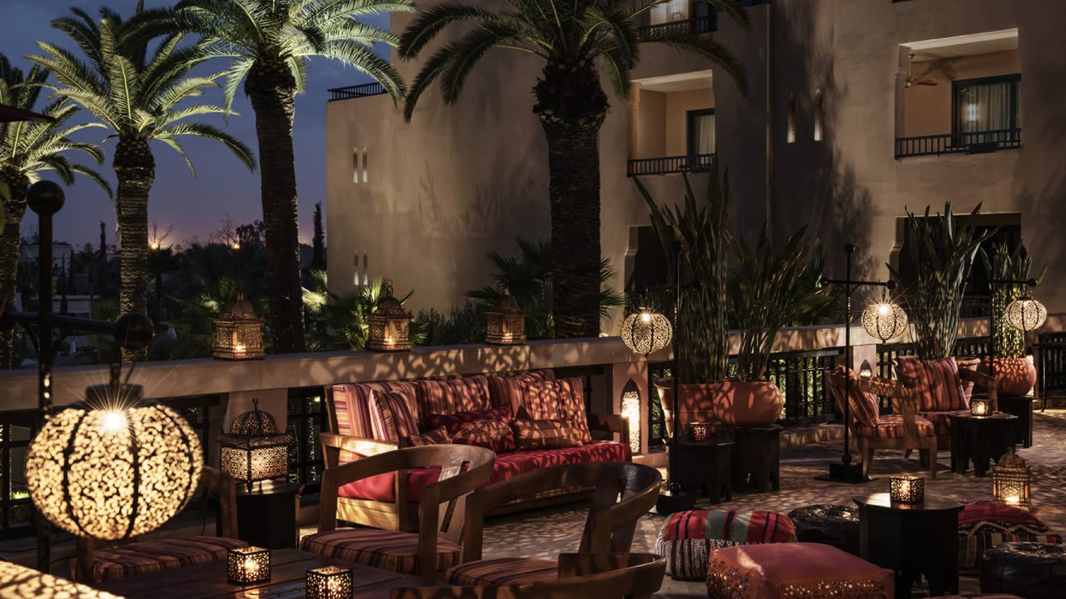Inara Lounge dimly-lit patio seating areas with lights, shadows from Moroccan lamps