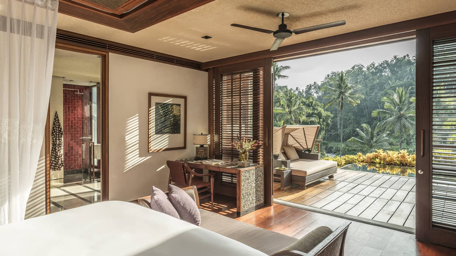 A scenic view from a spacious room overlooking a forest and river in Bali