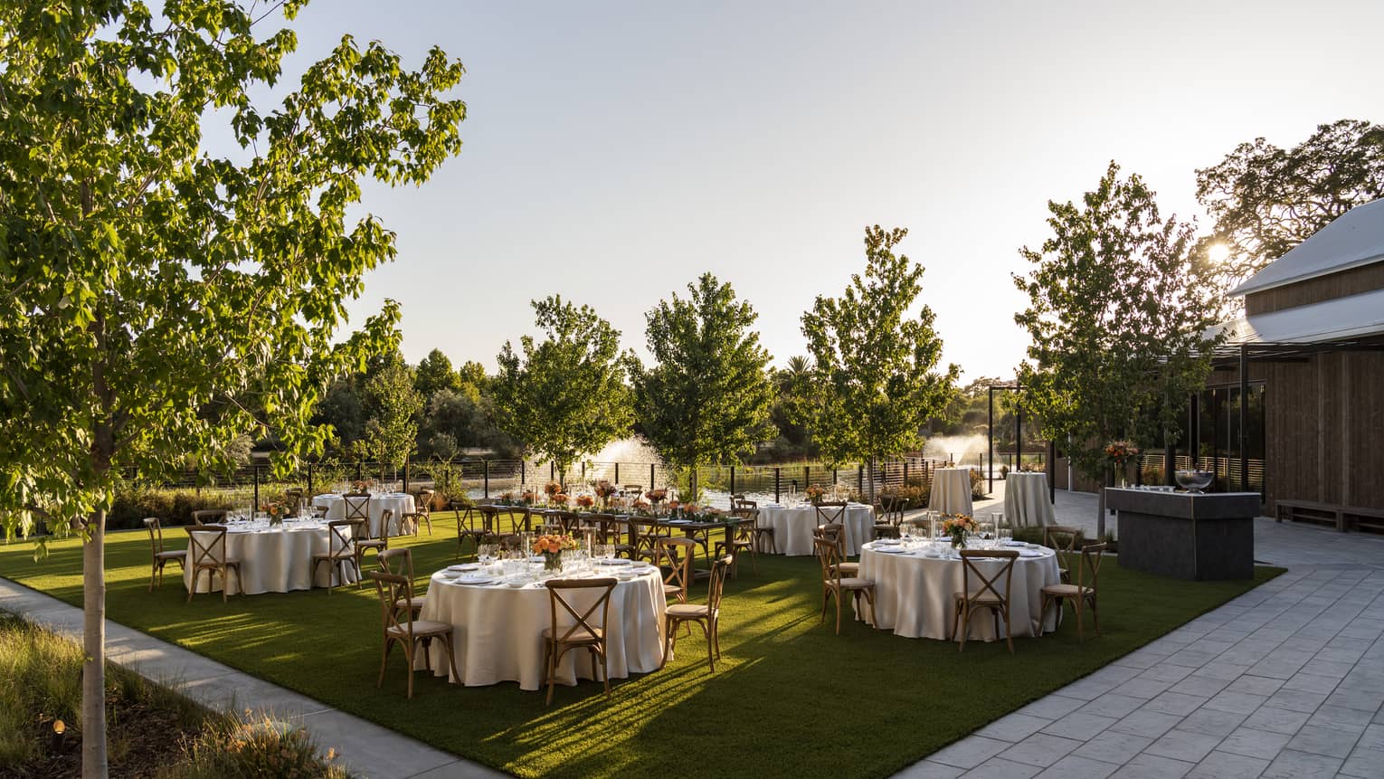 Banquet tables set up in outdoor garden