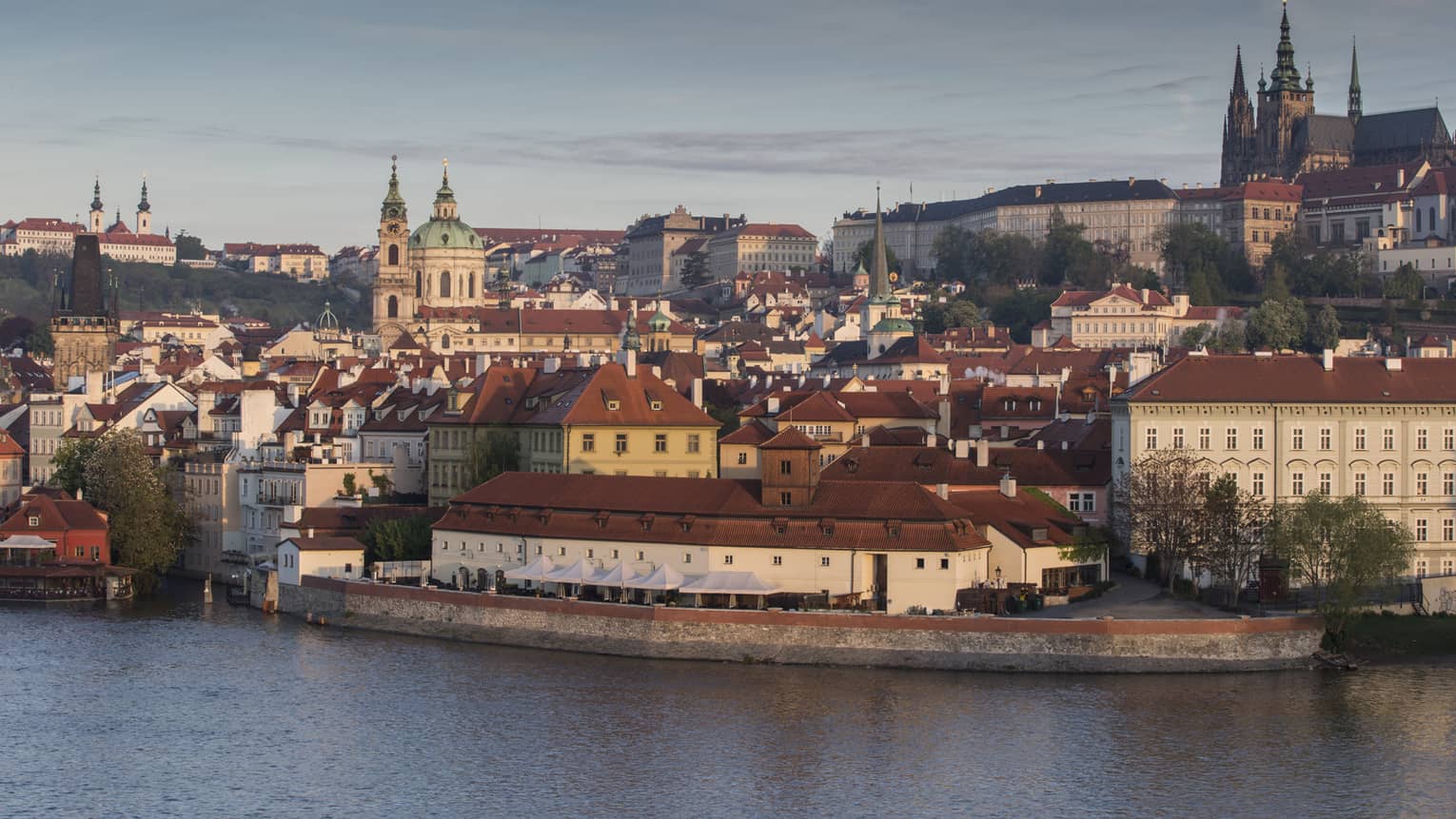 View across water to Prague city skyline