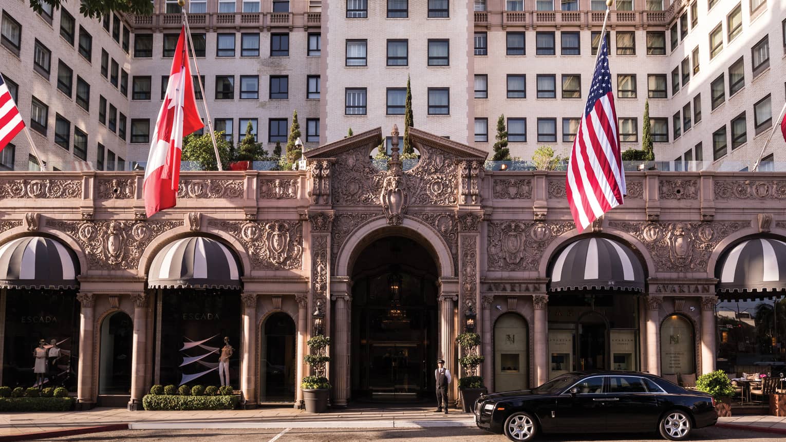 Beverly Wilshire, A Four Seasons Hotel grand front entrance with American, Canadian flags