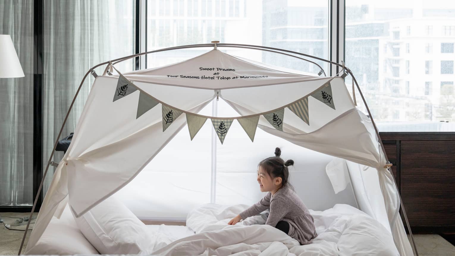 Little girl in kids glamping tent