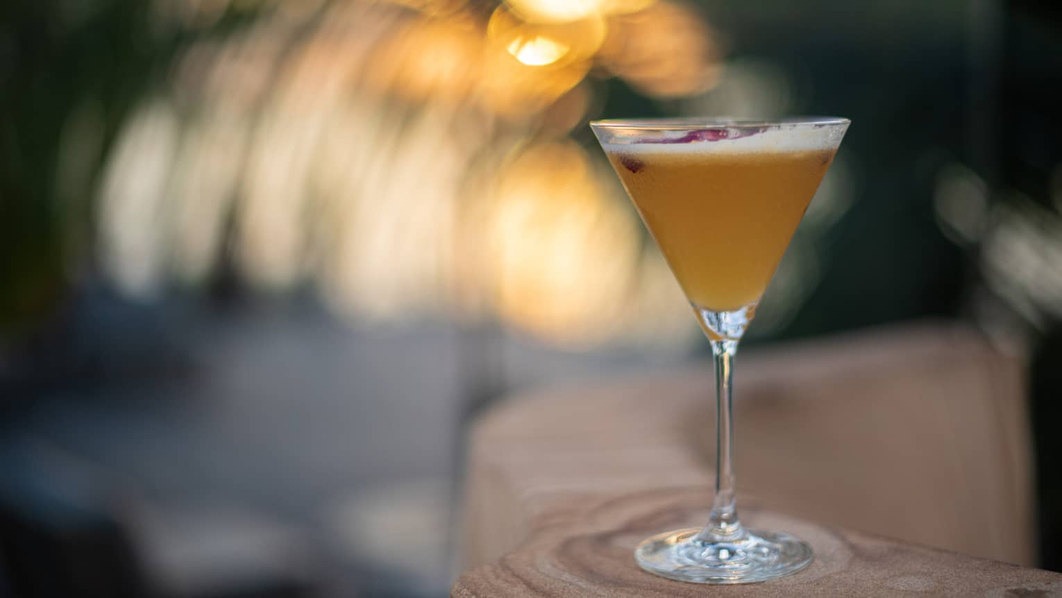 Cocktail in martini glass on bar at Four Seasons Anguilla Sunset Lounge 