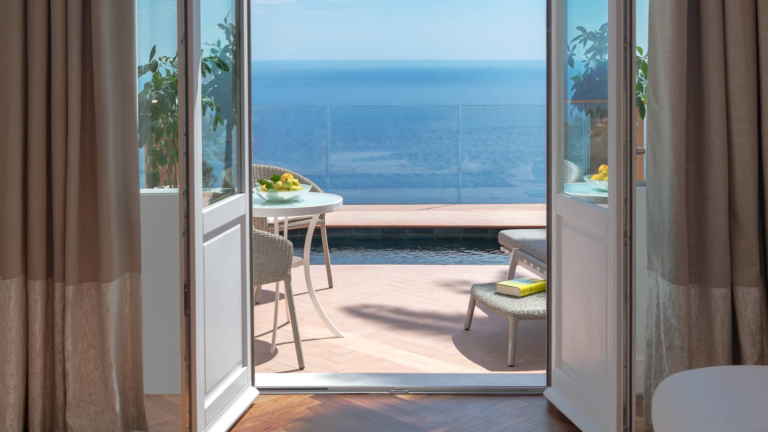Door leading to private terrace with plunge pool overlooking the sea