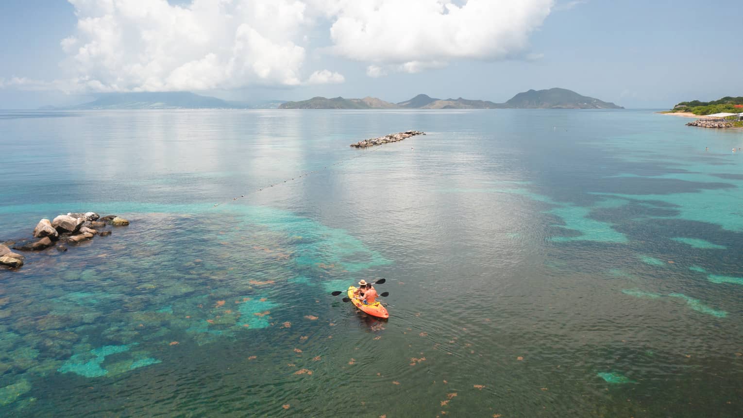 A kayak out on water.