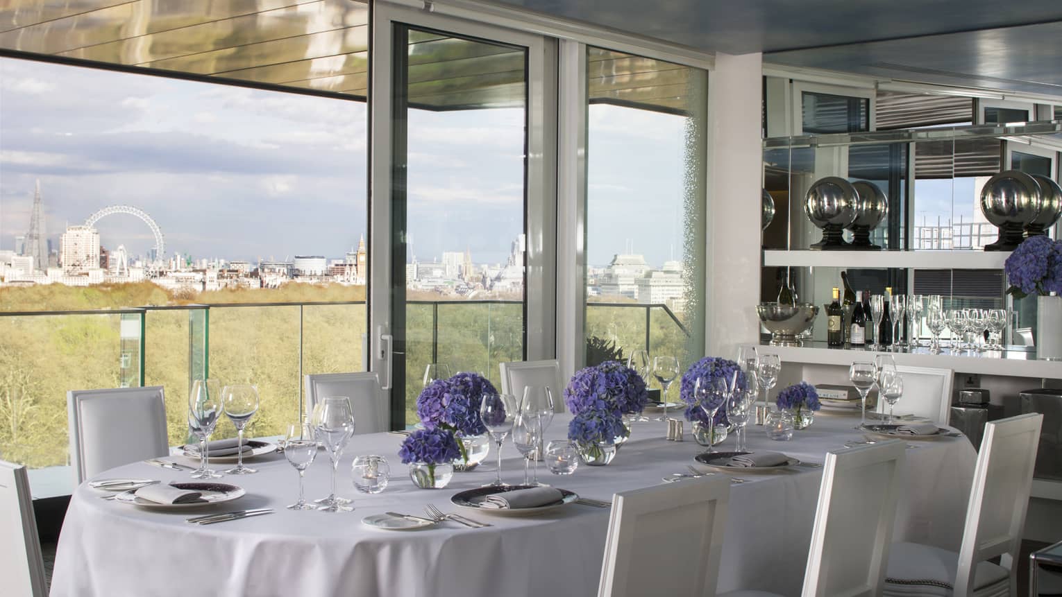 Private dining table along sunny window with London views in Tenth Floor Lounge 