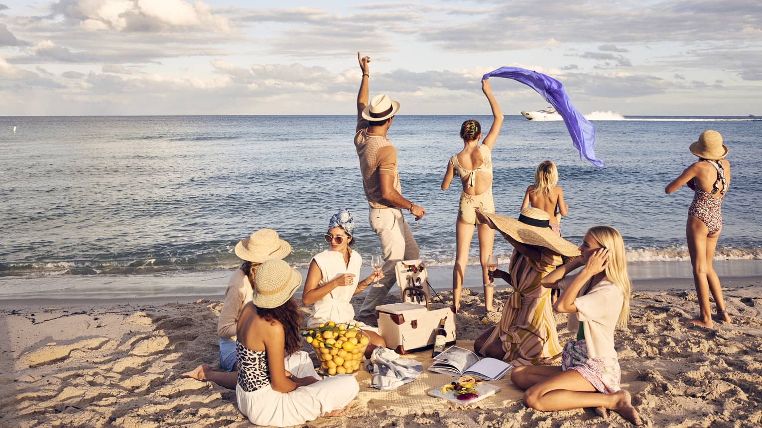 A group of people having a picnic on a beach.