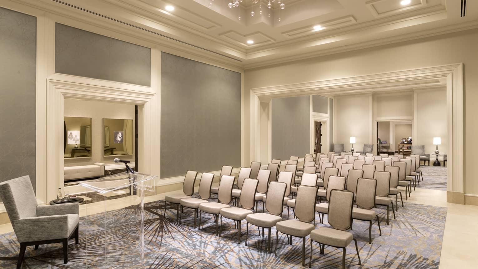 Palm Ballroom Foyer conference with rows of chairs facing plush armchair 