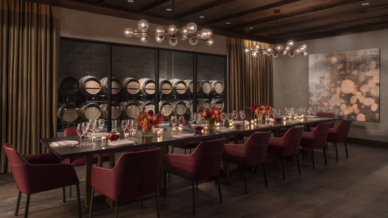 Private dining room, long table with 14 chairs, wooden ceiling, wine barrels