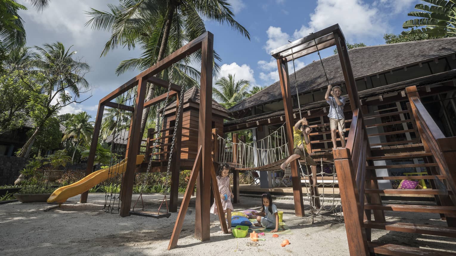 Kids playing on the play set in the kids club at Four Seasons Langkawi
