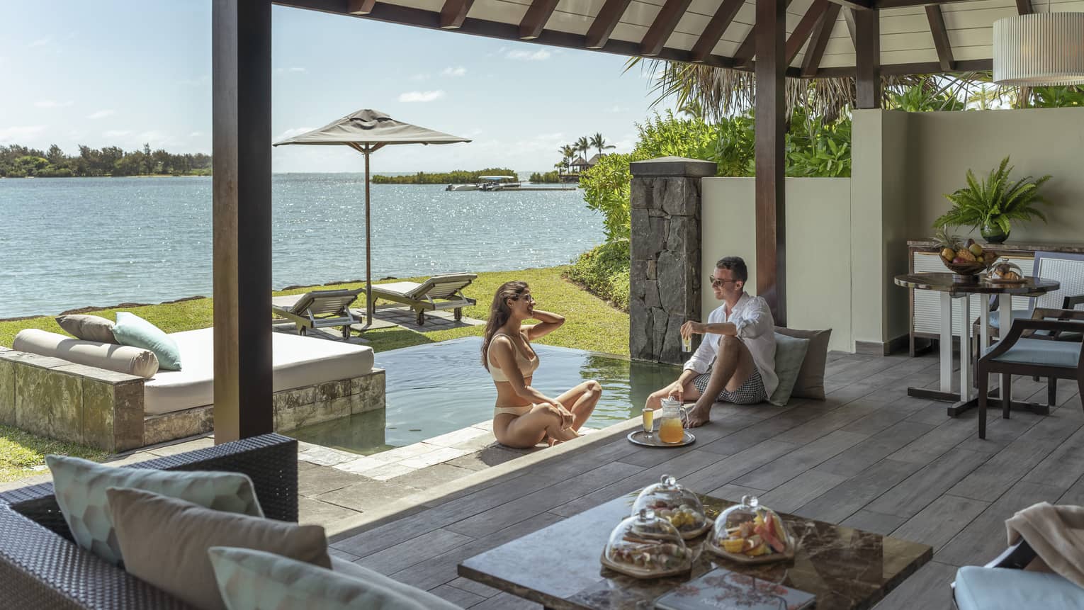 Couple enjoys in-villa dining poolside