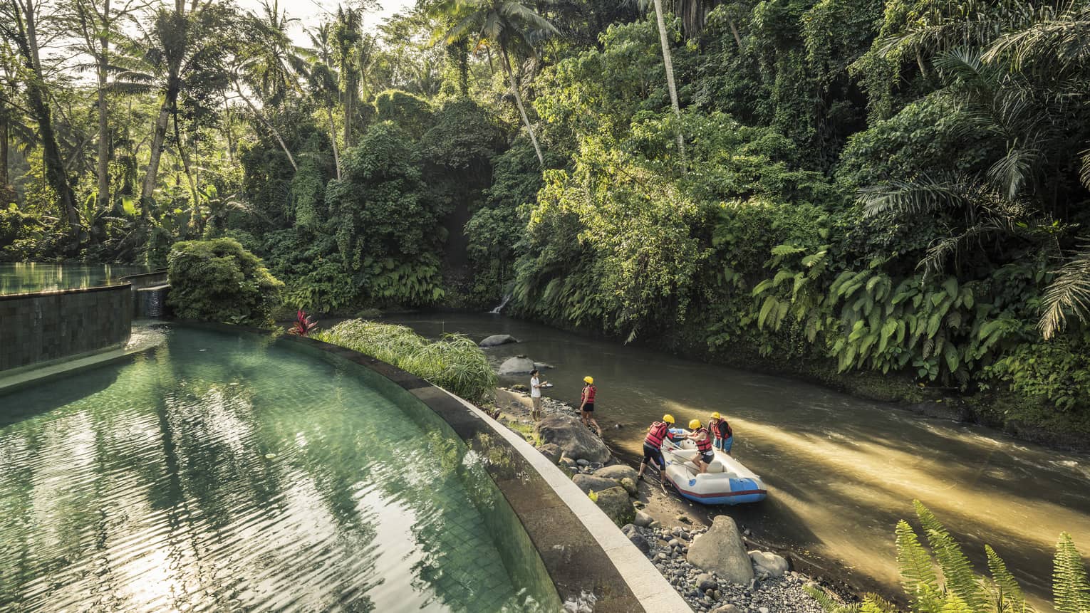 An aerial view of four seasons guests arriving to the sister Bali Resort in a raft \