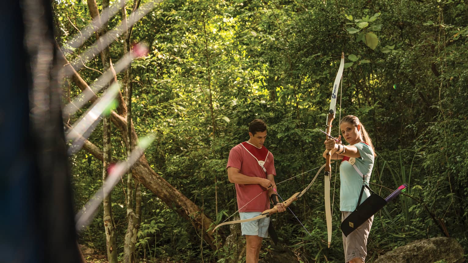 Couple practices archery in the Langkawi jungle