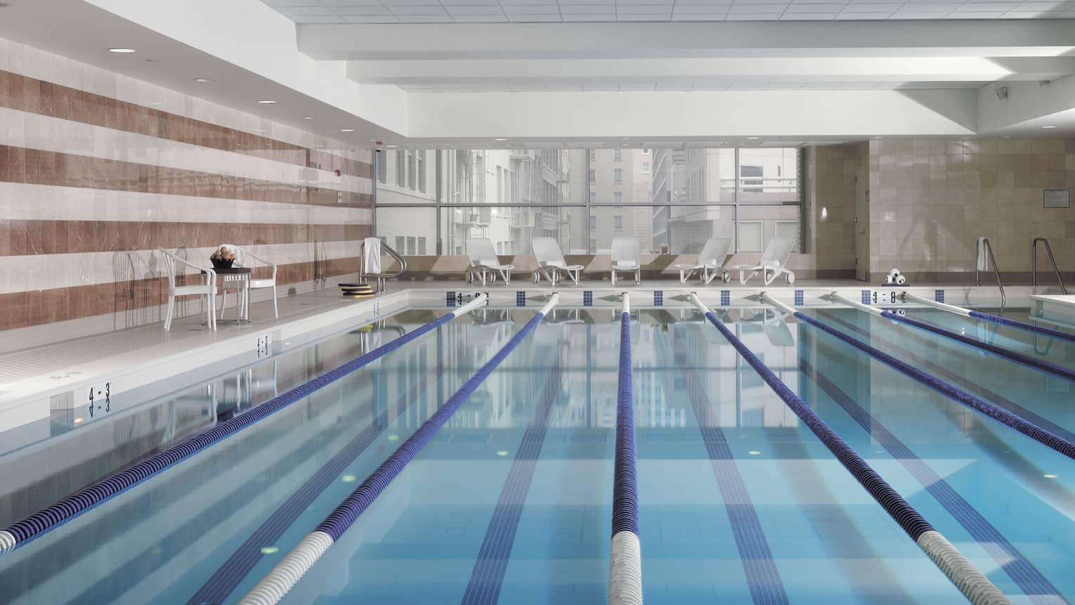 View across indoor swimming pool with divided lanes 