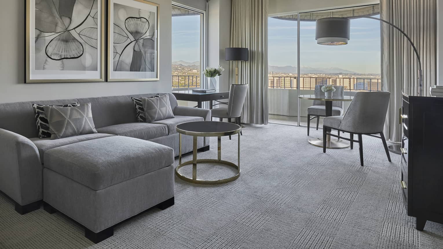 Living room with floor-to-ceiling windows in a Luxury Suite