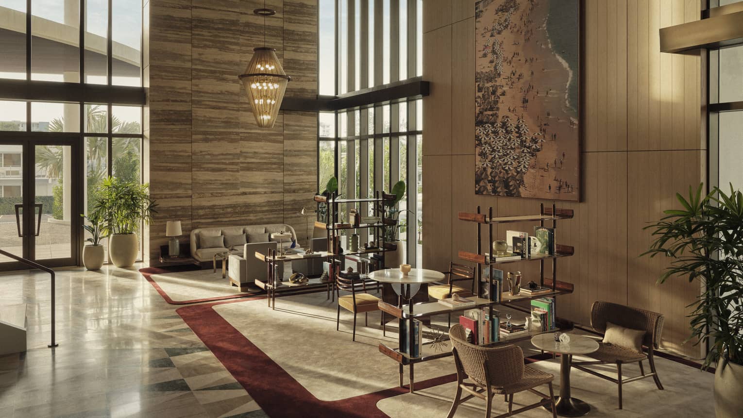 A lobby seating area with various chairs and sofa, as well as bookshelves and art.