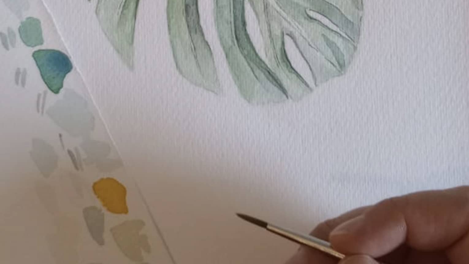 Watercolour painting of a green leaf.