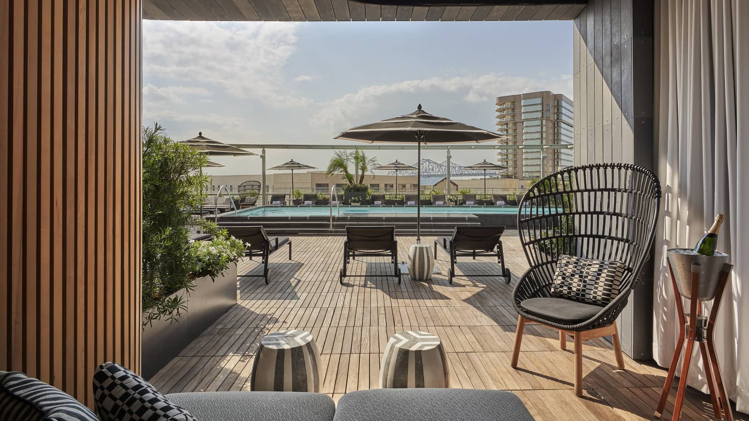 A cabana near an outdoor pool.