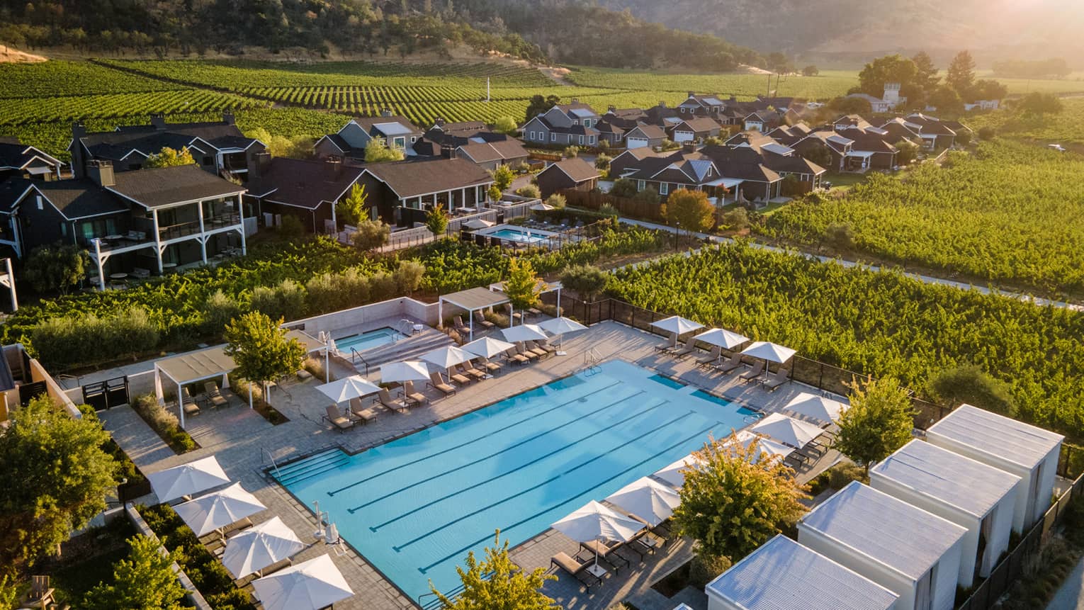 Aerial view of lap pool with surrounding cabanas at Four Seasons Resort and Residences Napa Valley