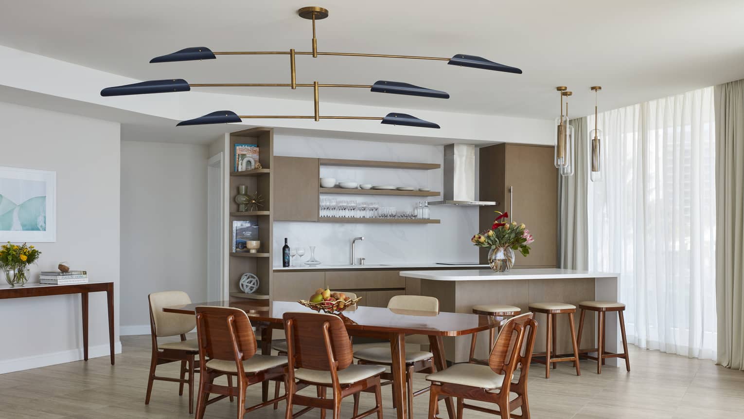 Kitchen and dining table with modern lighting fixture