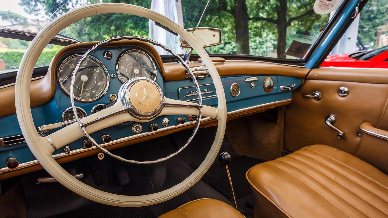 Wheel, dashboard, leather seats of classic luxury car