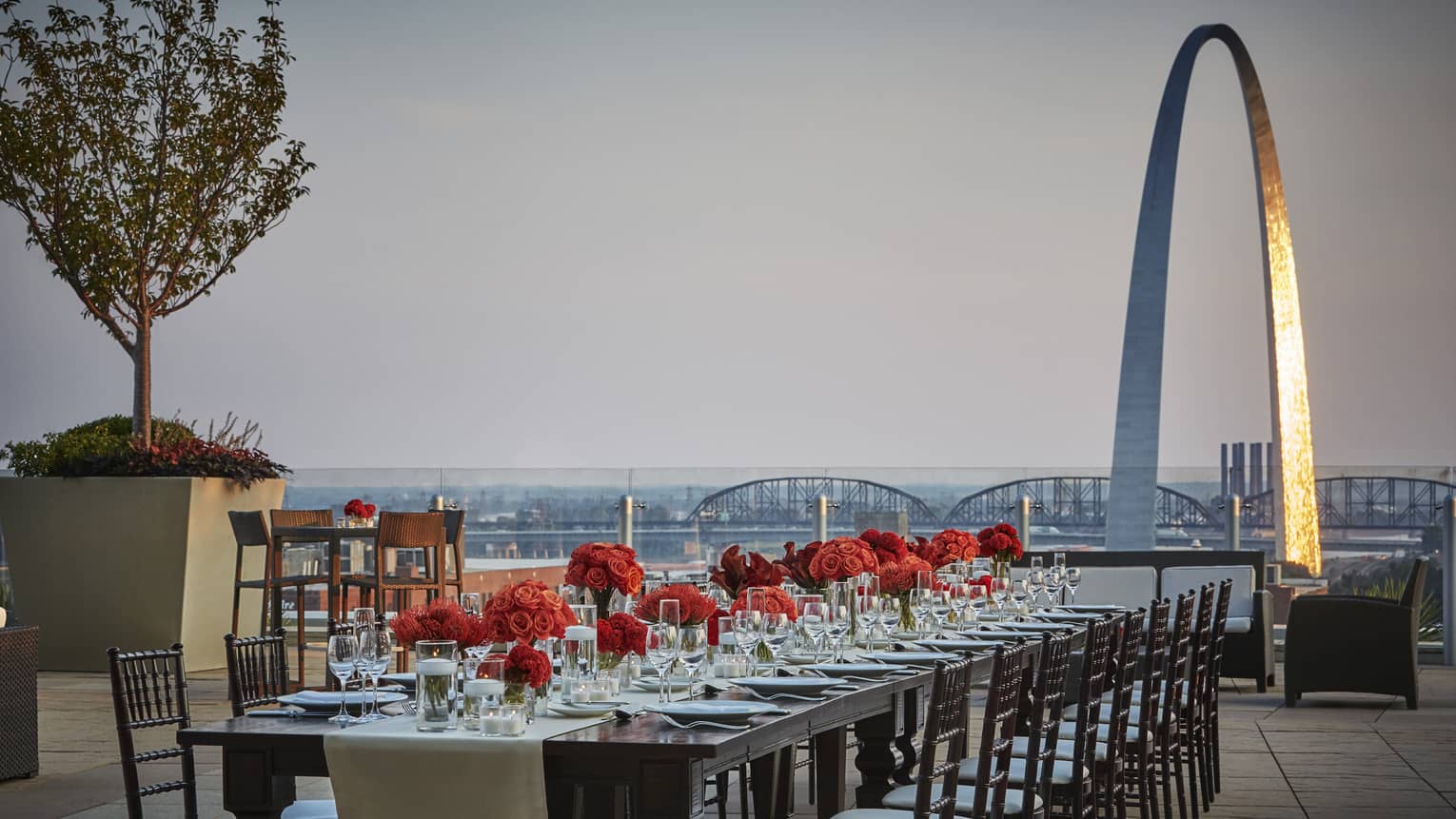Private dining table on eighth-floor terrace with view of Gateway Arch