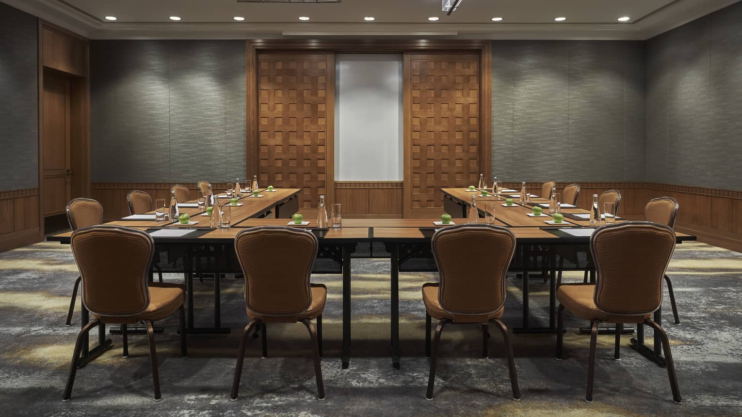 A boardroom surrounded by chairs.