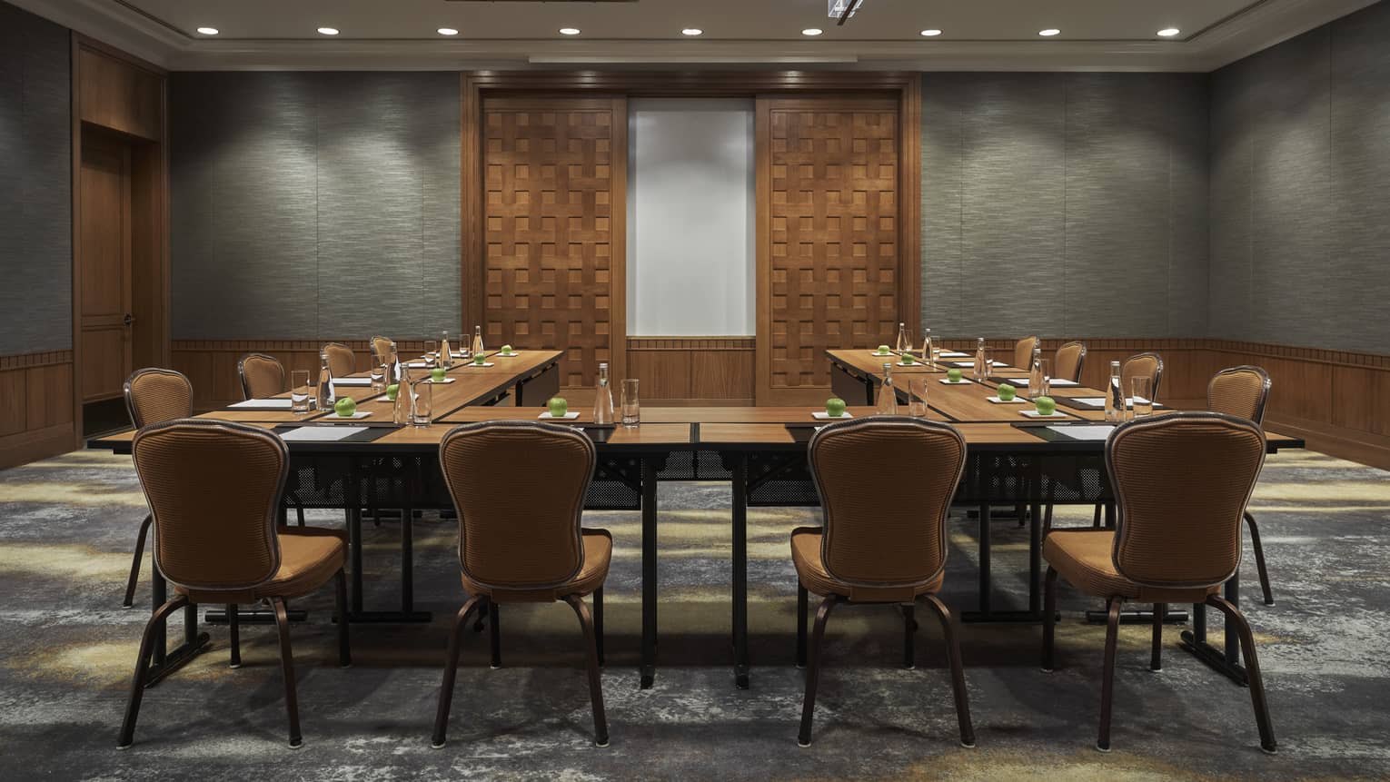 A boardroom surrounded by chairs.