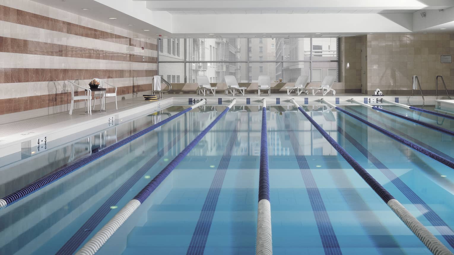 View across indoor swimming pool with divided lanes 